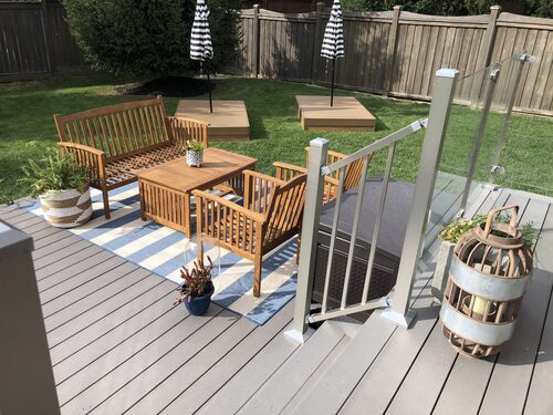 Image of pressure treated deck with aluminum pickets